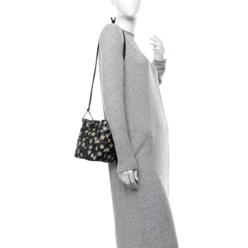 BOTTEGA VENETA Nappa Maxi Intrecciato Daisy Print Small Cassette Bucket Bag Black White Yellow BOTTEGA VENETA Nappa Maxi Intrecciato Daisy Print Small Cassette Bucket Bag Black White Yellow